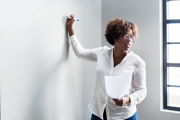 Woman summarizing work in a meeting