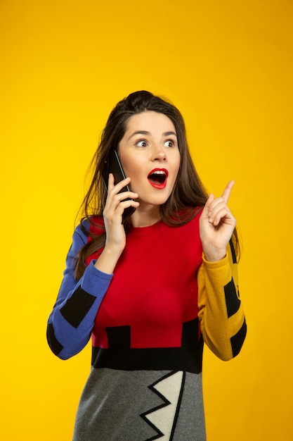 Woman surprised while talking by phone