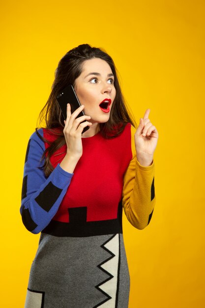 Woman surprised while talking by phone