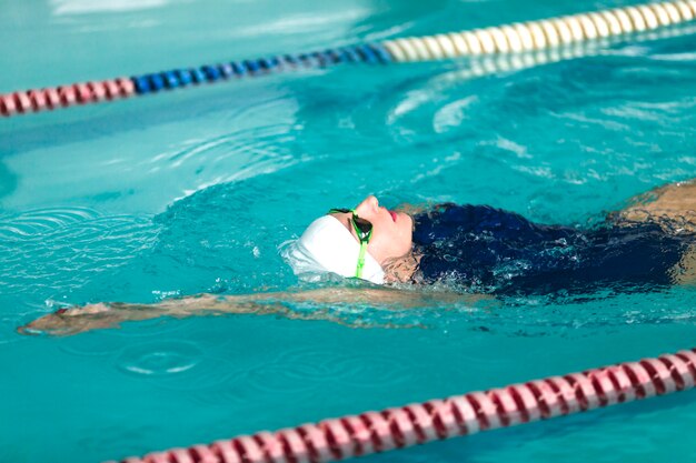 Woman swimmer swimming close up