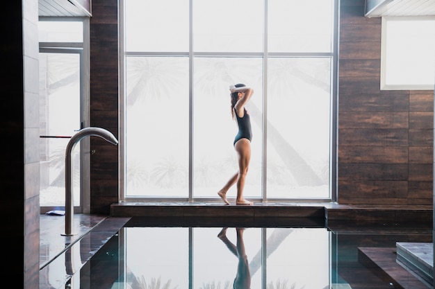 Woman next to swimming pool in spa