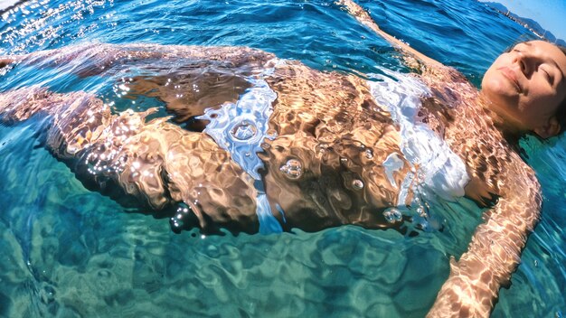 Woman swimming in the water, Mediterranean sea