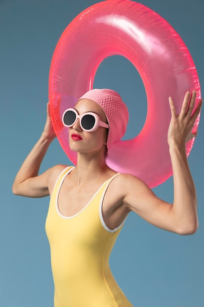 Woman in swimsuit with a swimming ring