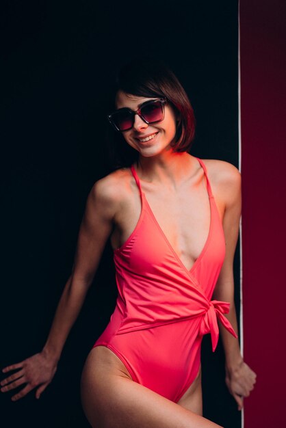 Woman in swimwear isolated in studio on background