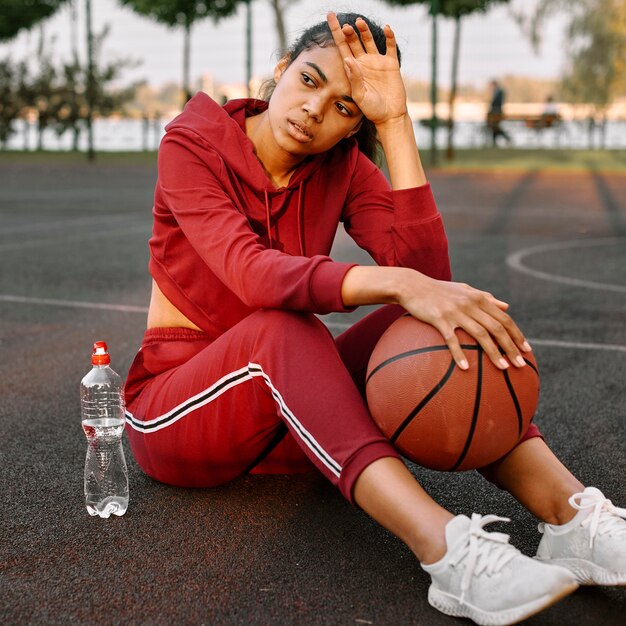 Woman taking a break after a basketball game