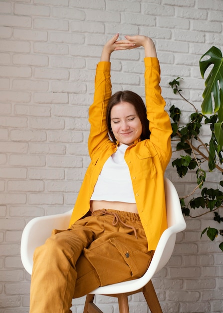 Free photo woman taking a break from gardening