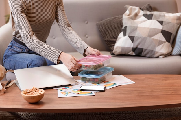 Woman taking a break from work and start eating