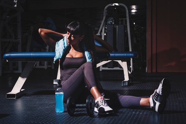 Woman taking a break in gym