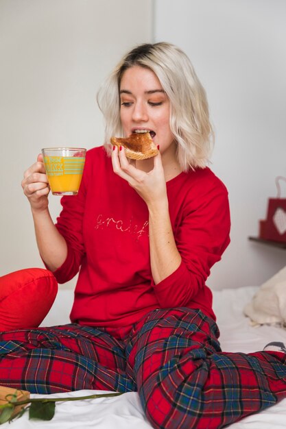 Woman taking breakfast on valentines day