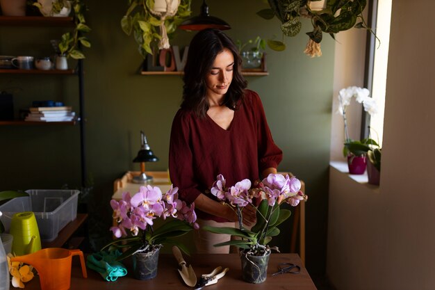 Woman taking care of exotic orchid