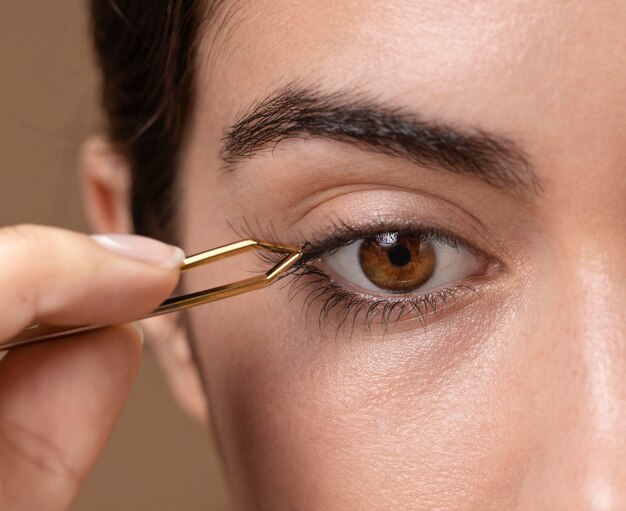 Woman taking care of her eyelashes