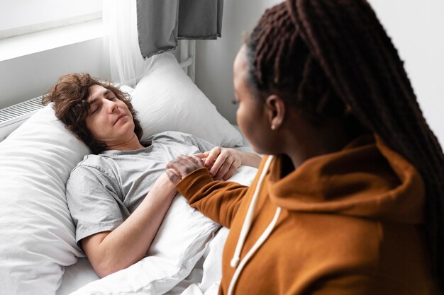 Woman taking care of her ill friend