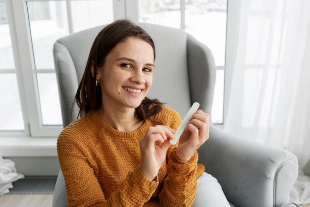 Woman taking care of her nails