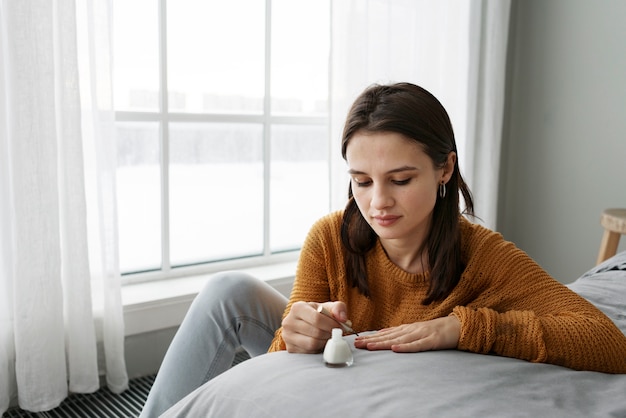 Woman taking care of her nails