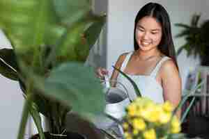 Free photo woman taking care of plants