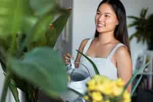 Free photo woman taking care of plants