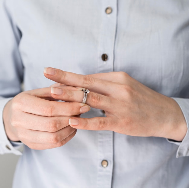 Woman taking off marriage ring