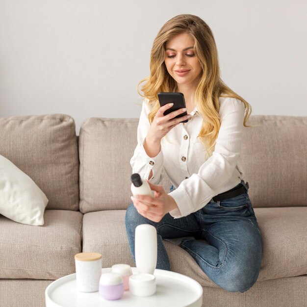 Woman taking photo of bottle