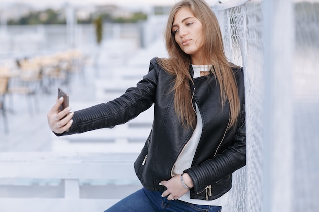 Free photo woman taking a photo of herself