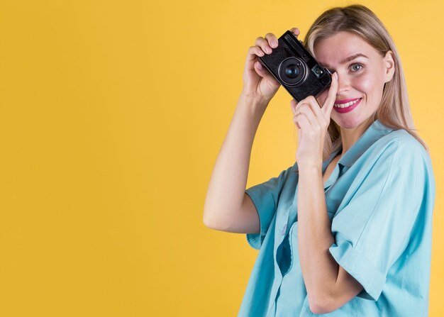 Woman taking a picture copy space