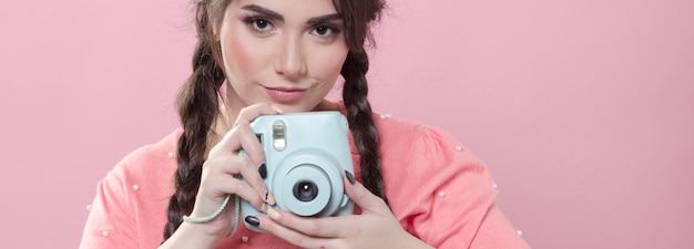 Woman taking picture with camera