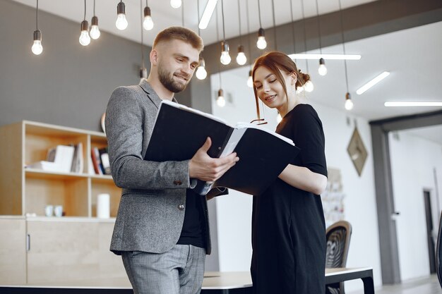 Woman talking to the director.Businessman with documents.Colleagues work together