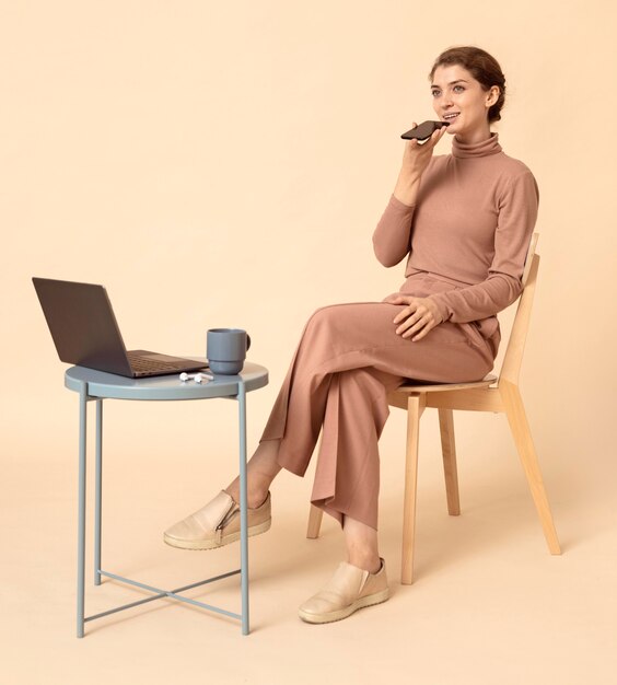 Woman talking on mobile phone speaker