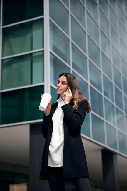 Woman talking on phone medium shot