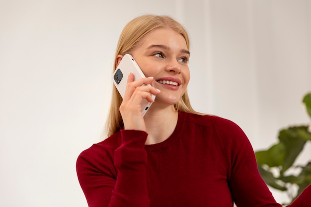 Woman talking on phone medium shot