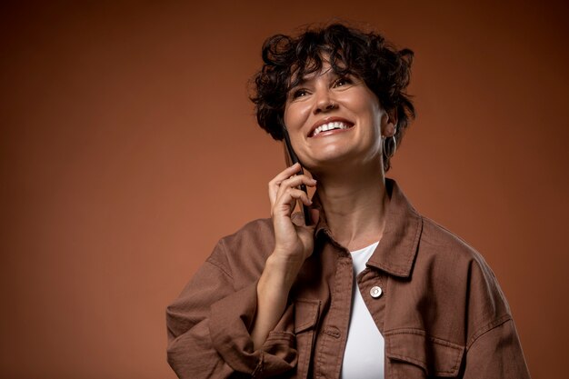 Woman talking on phone medium shot