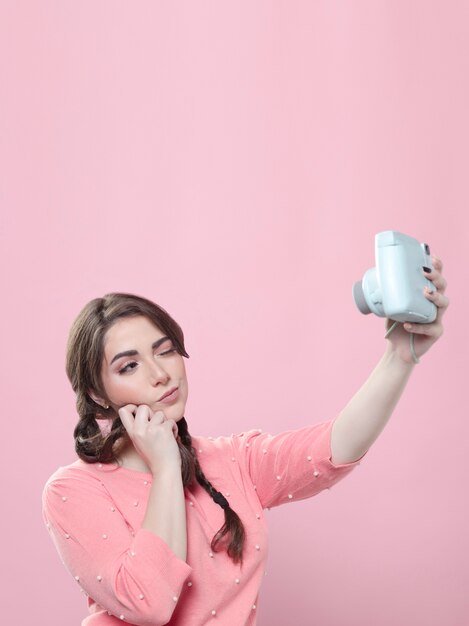 Woman talking selfie with camera
