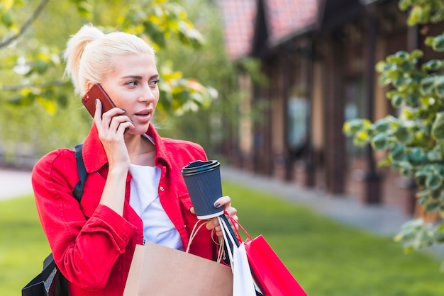 Woman talking smartphone in park