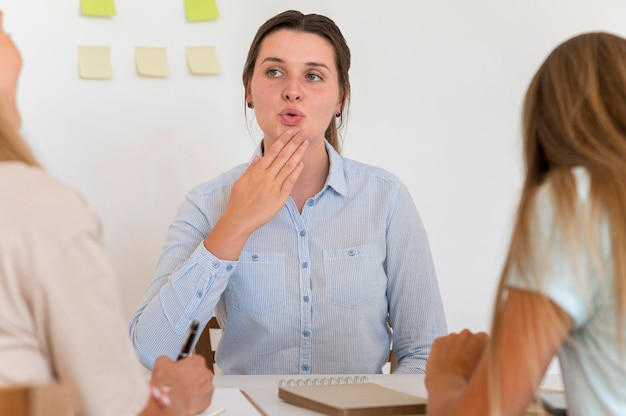 Woman teaching the sign language