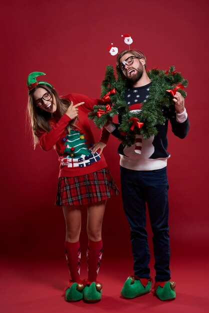 Woman teasing her boyfriend with garland