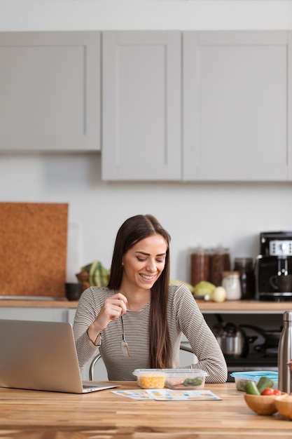 Woman teleworking is having a lunch break