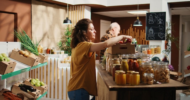 Free photo woman tests bio shop apples are organic