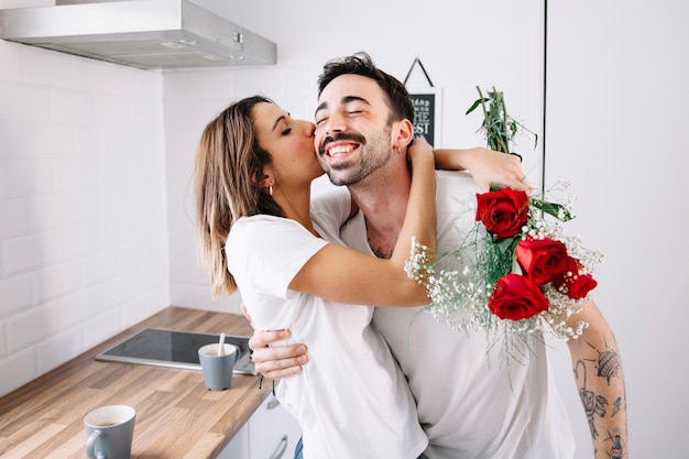 Woman thanking man for flowers