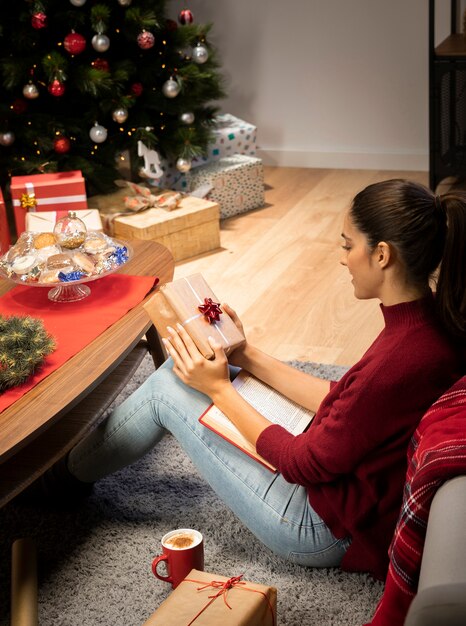 Woman that is holding a gift