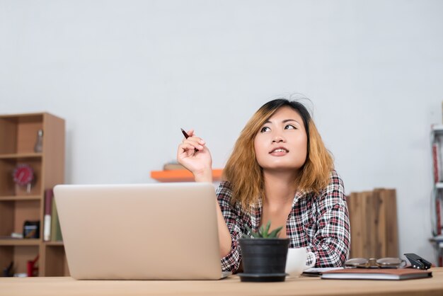 Woman thinking at work