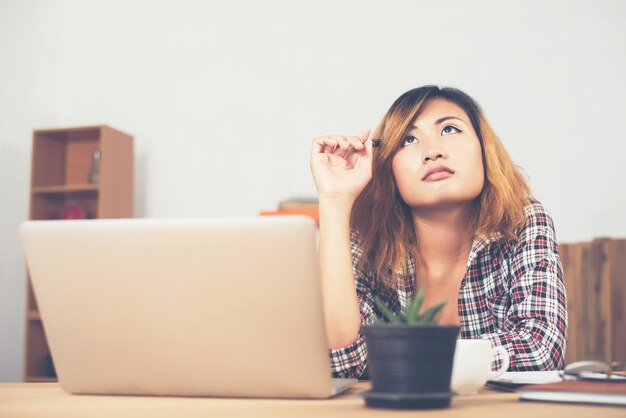 Woman thinking at work