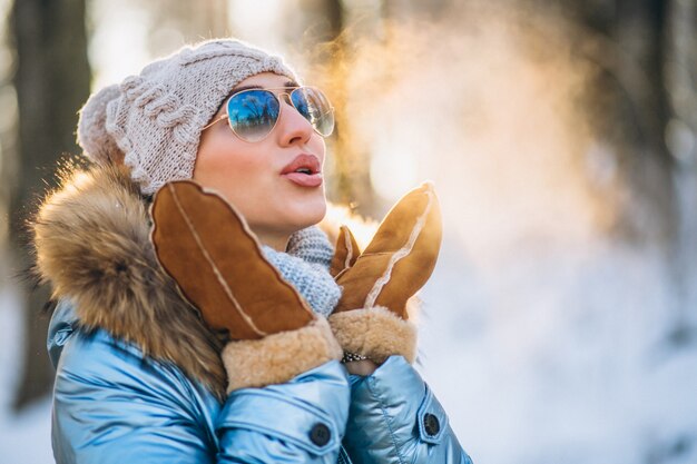 Woman throwing snow