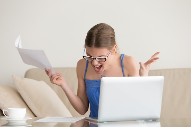 Woman tired and angry because of hard paperwork