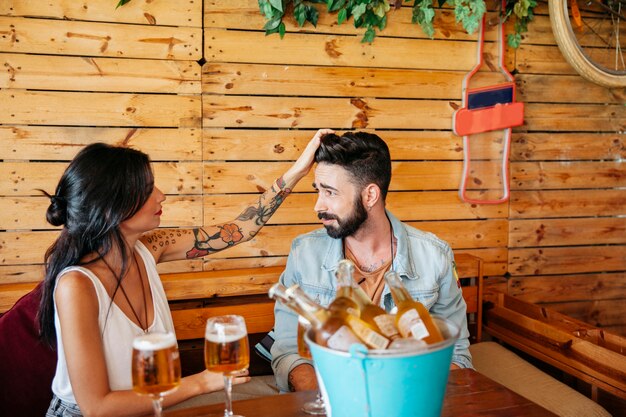 Woman touching hair of friend