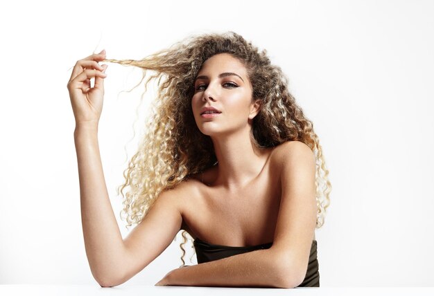 Woman touching her curly hair