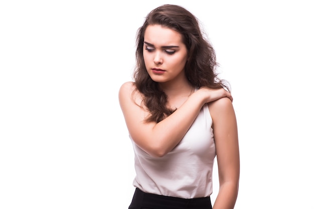 Woman touching her elbow against white background