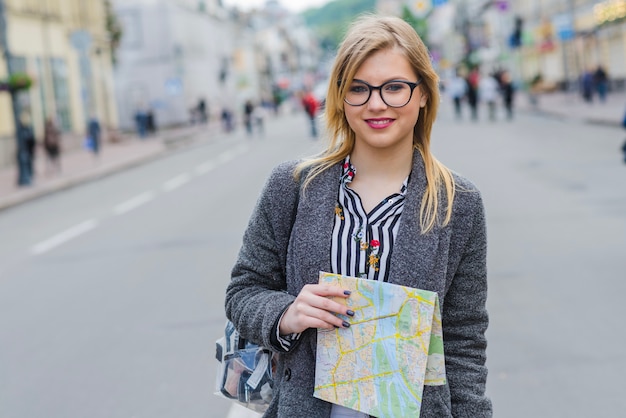 Woman tourist walking with map