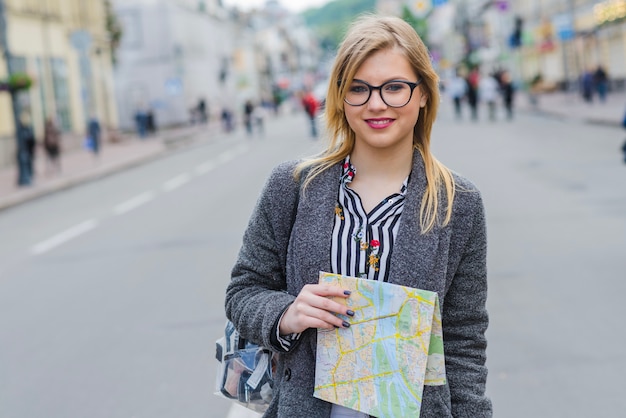 Free photo woman tourist walking with map