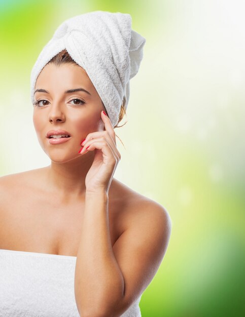 Woman in towel looking at camera