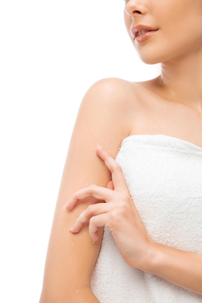 Woman in towel posing on white