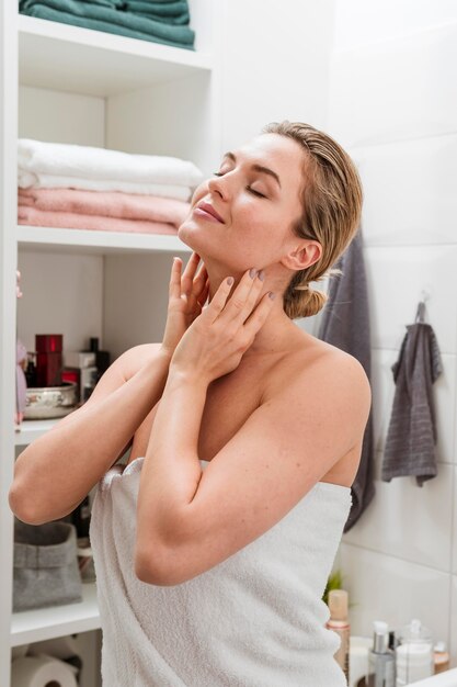 Woman in towel self care at home concept